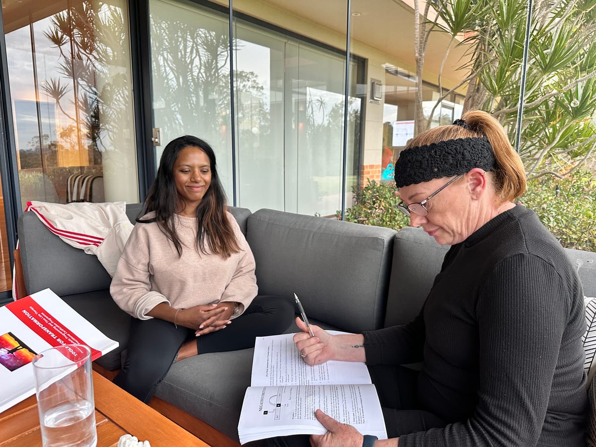 Participants practising a coaching technique together