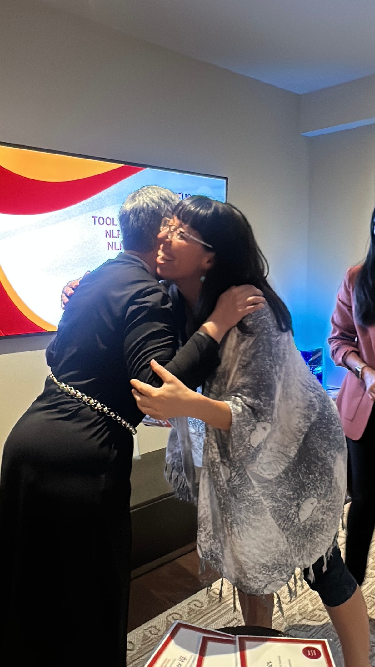 Two participants embracing after a breakthrough session