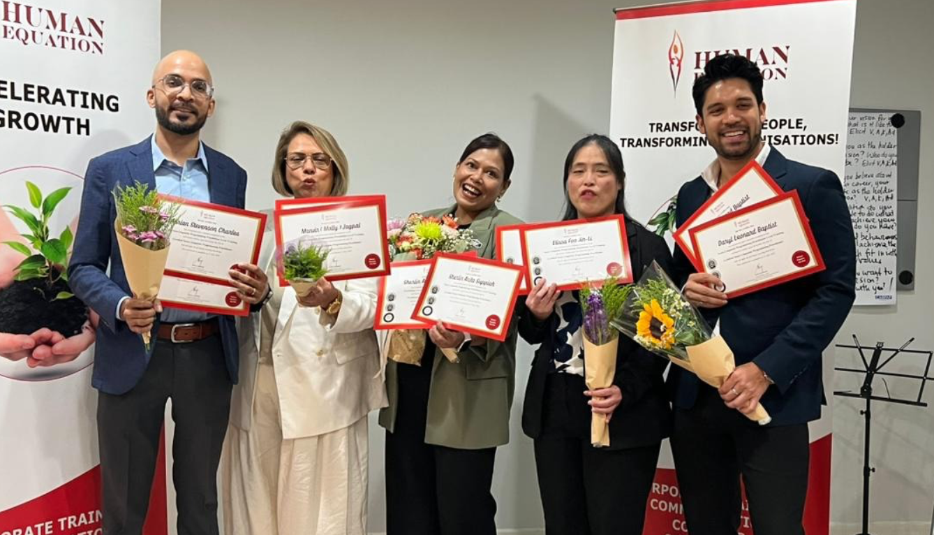 NLP certification graduates holding their certificates